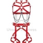 Leather harness with open bust and chains paired with a leather garter belt. Photographed in 3D. Shows how the straps look from the inside and outside. Red leather, dark nickel hardware. Front view.