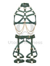 Leather harness with open bust and chains paired with a leather garter belt. Photographed in 3D. Shows how the straps look from the inside and outside. Green leather, gold hardware. Front view.