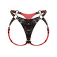 Close front view of an adjustable strap-on harness with a triangular front panel, interchangeable rings in different diameters, adjustable leather straps, black leather with red edges, and dark nickel hardware.