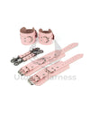 Pink leather handcuffs and ankle cuffs with two connectors and carabiners. One handcuff and ankle cuff clasped, the other unclasped to show the difference in length. Dark nickel hardware.