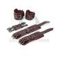 Marsala leather handcuffs and ankle cuffs with two connectors and carabiners. One handcuff and ankle cuff clasped, the other unclasped to show the difference in length. Dark nickel hardware.