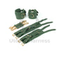 Green leather handcuffs and ankle cuffs with intertwined X straps and two carabiner connectors. One cuff and ankle cuff buckles, the other unbuckles to show the difference in length. Gold hardware.