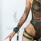 Full body harness. Green leather, gold colored hardware. 
Close-up front view, the arms are attached to the harness with special connectors that are included in the kit.
