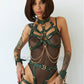 Full body harness. Green colored leather, gold colored hardware. 
Front full-length view shows how the straps on the harness pass through the crotch leaving open access.