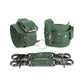 Green leather handcuffs with two connectors and carabiners lie side by side, one handcuff is shown from the side of the buckle and lies half sideways the second handcuff stands half sideways and is shown from the side of the D-ring for which the carabiner is fixed. Dark nickel hardware. 
