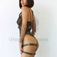 Wide bondage chest straps with leather garter belt. Side view on model. Green leather. Gold-tone hardware.