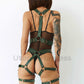 Wide bondage chest straps with leather garter belt. Back view on model. Green leather. Gold-tone hardware.
