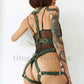 Wide bondage chest straps with leather garter belt. Close-up model's side view. Green leather. Gold hardware.