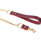 Marsala leather leash with gold chain and clasp on a white background