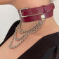 Marsala leather choker with silver chain detail worn by a person