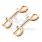 Close-up of 2 double carabiners in gold color.