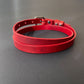 Red leather choker on a gray background