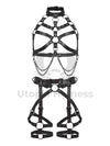 Leather harness with open bust and chains paired with a leather garter belt. Photographed in 3D. Shows how the straps look from the inside and outside. Black leather, dark nickel hardware. Front view.