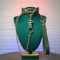 Bondage collar and leash a green mannequin against a textured white background