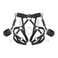 Leather garter belt with open butt and crotchless harness. With handcuffs fastened to D-rings. Back view on invisible mannequin. Demonstrates how the harness will sit on the body. Dark nickel hardware, black leather.