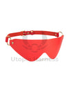 Narrow leather bondage mask to cover the eyes. 
Red leather, gold hardware.