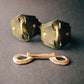 Pair of green handcuffs on a dark gray background